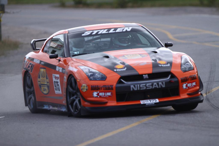 STILLEN GT-R turning hard during rally stage. 