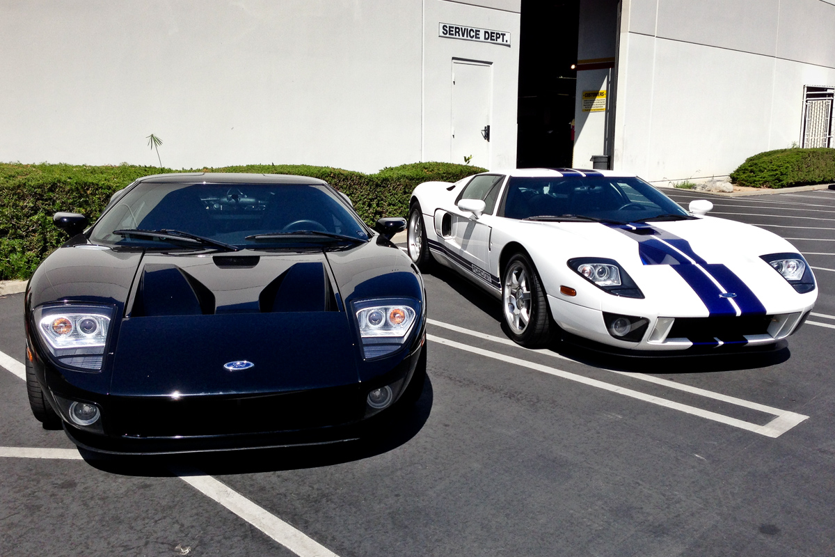black and white Ford GTs outside service area