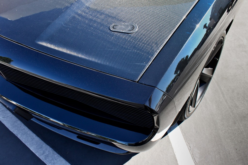 carbon fiber hood covering the magnuson supercharged challenger