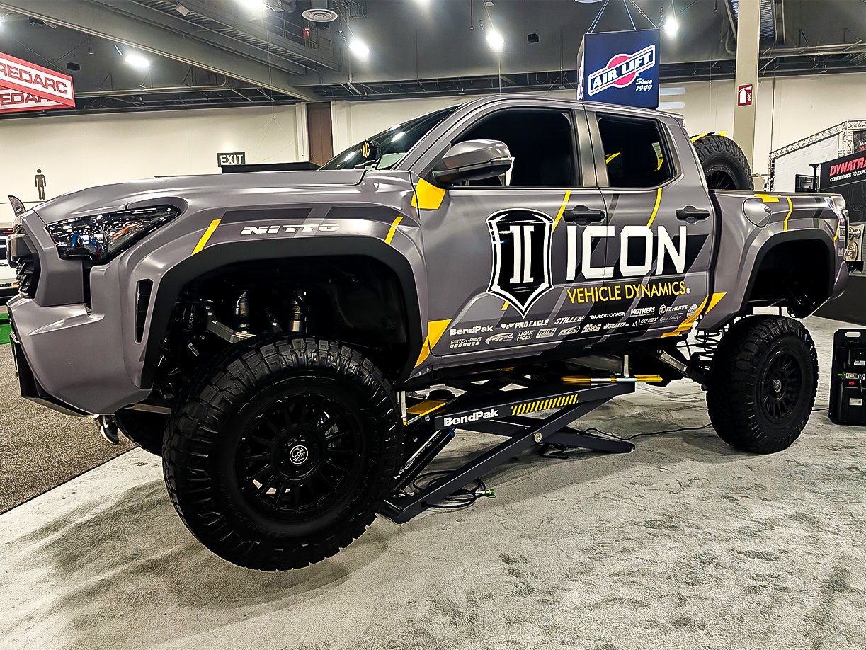 SEMA 2024 showcase featuring STILLEN's top picks: custom Nissan Z, Nissan Frontier Tarmac Edition, Infiniti QX80, Toyota Tacoma builds with Icon Vehicle Dynamics suspension, TruControl tuner, and TruPower intake, and Toyota's concept off-roaders including TRD Surf and Land Cruiser Rox