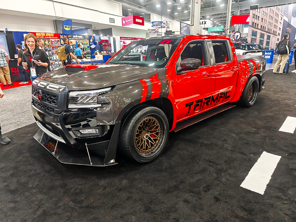 SEMA 2024 showcase featuring STILLEN's top picks: custom Nissan Z, Nissan Frontier Tarmac Edition, Infiniti QX80, Toyota Tacoma builds with Icon Vehicle Dynamics suspension, TruControl tuner, and TruPower intake, and Toyota's concept off-roaders including TRD Surf and Land Cruiser Rox